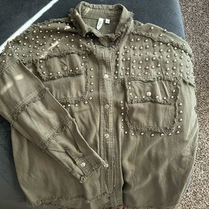 Oversized button up shirt. Cute studded detailing.